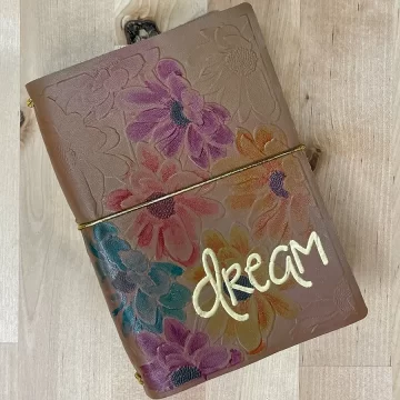 A Crafters Traveler's Notebook with the word dream on it.