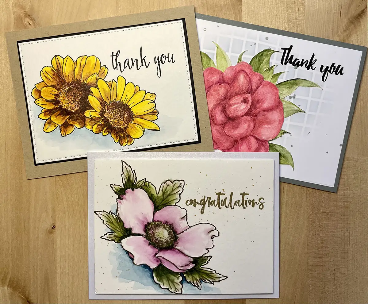 Three beautiful cards colored using watercolor paints.