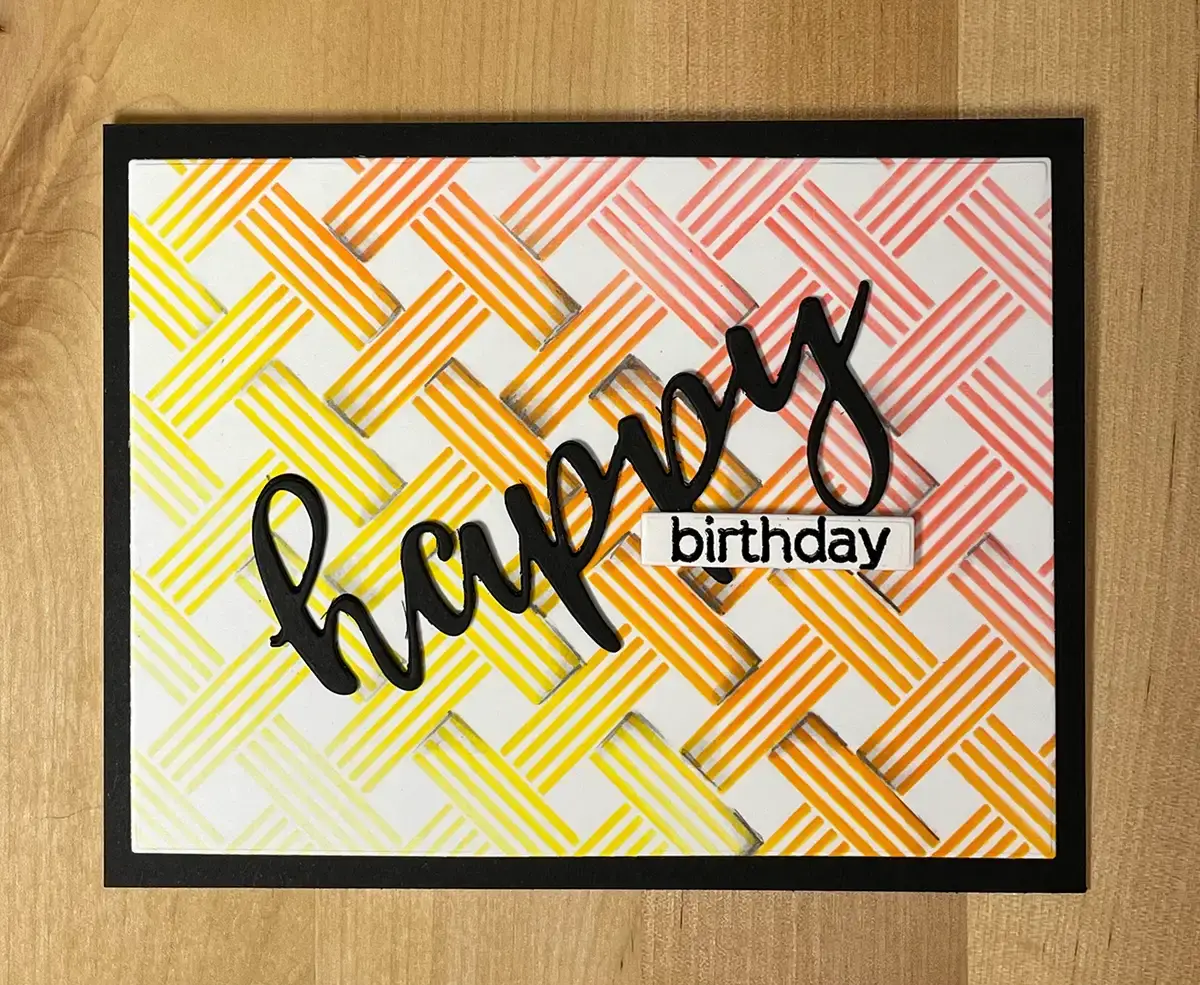 A birthday card featuring an optical illusion and a happy birthday message.