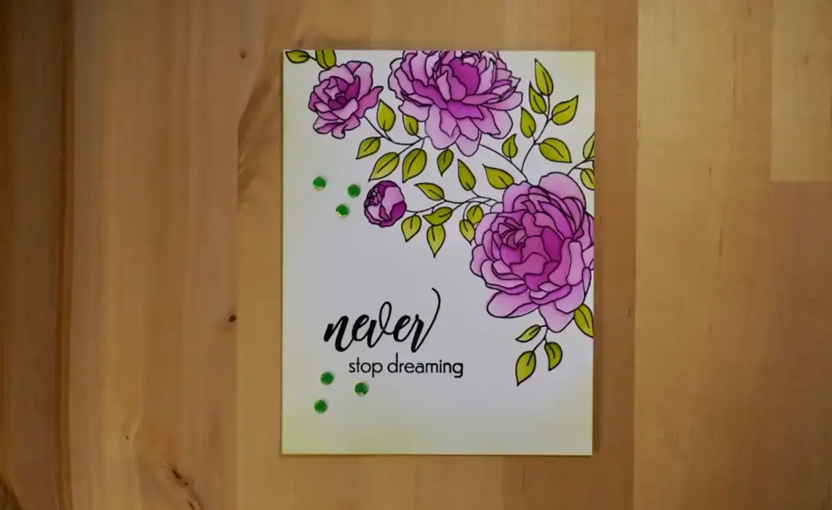A card with purple flowers on it, blended with stencils.