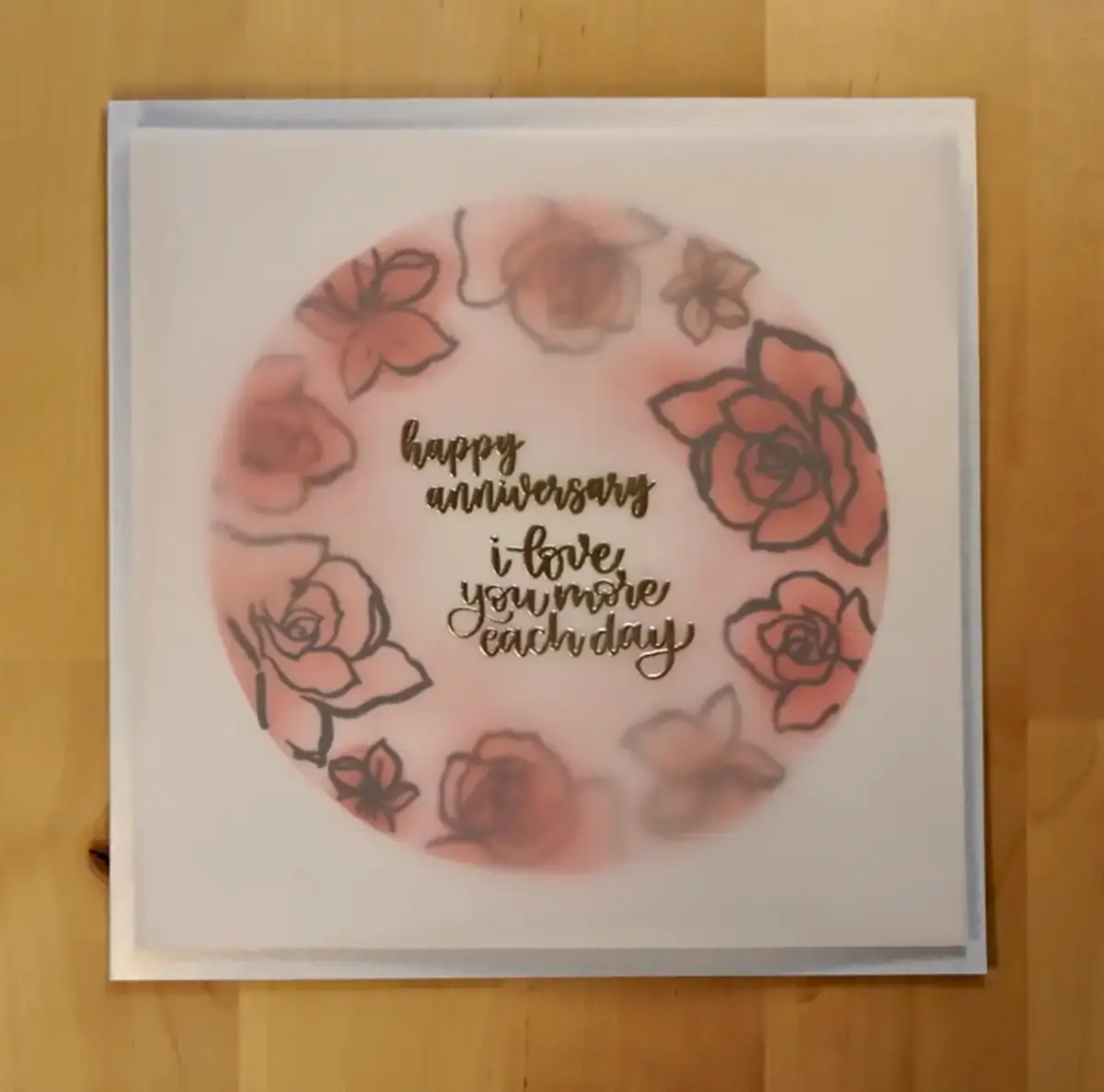 A unique anniversary card with roses on it.
