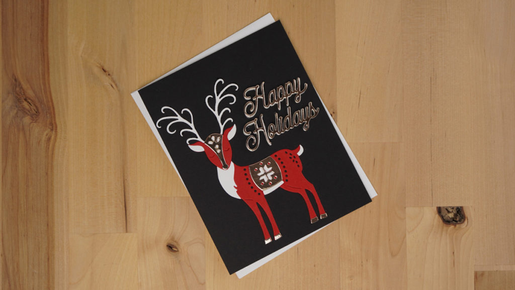 Stunning black, red, white, and gold holiday card made with Nordic Spellbinders Magical Deer and Classic Happy Holidays die sets.