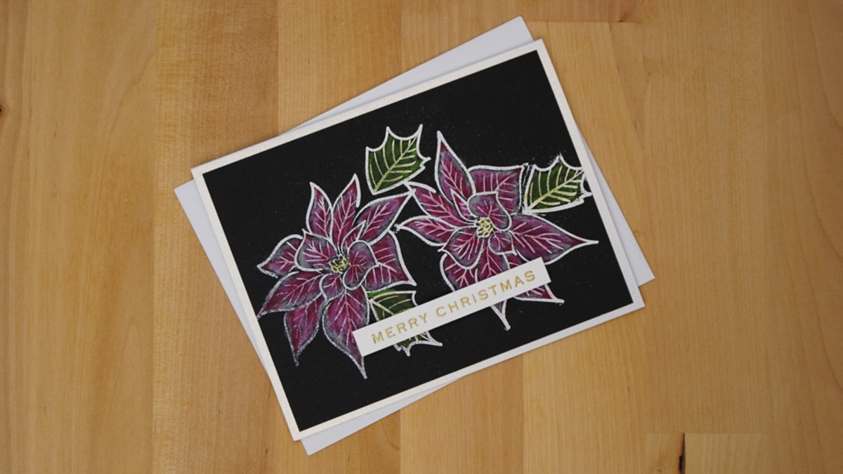 Beautiful black Christmas cards with poinsettias colored with colored pencils.