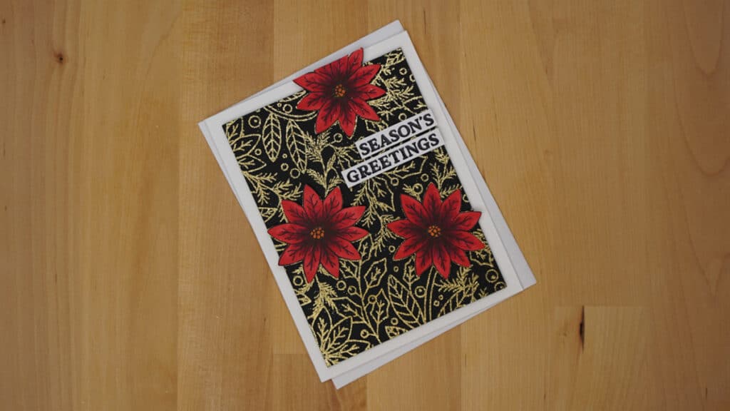 My fav Christmas card is stunning with it's red poinsettias on black background with it's coordinating glittery gold pattern.