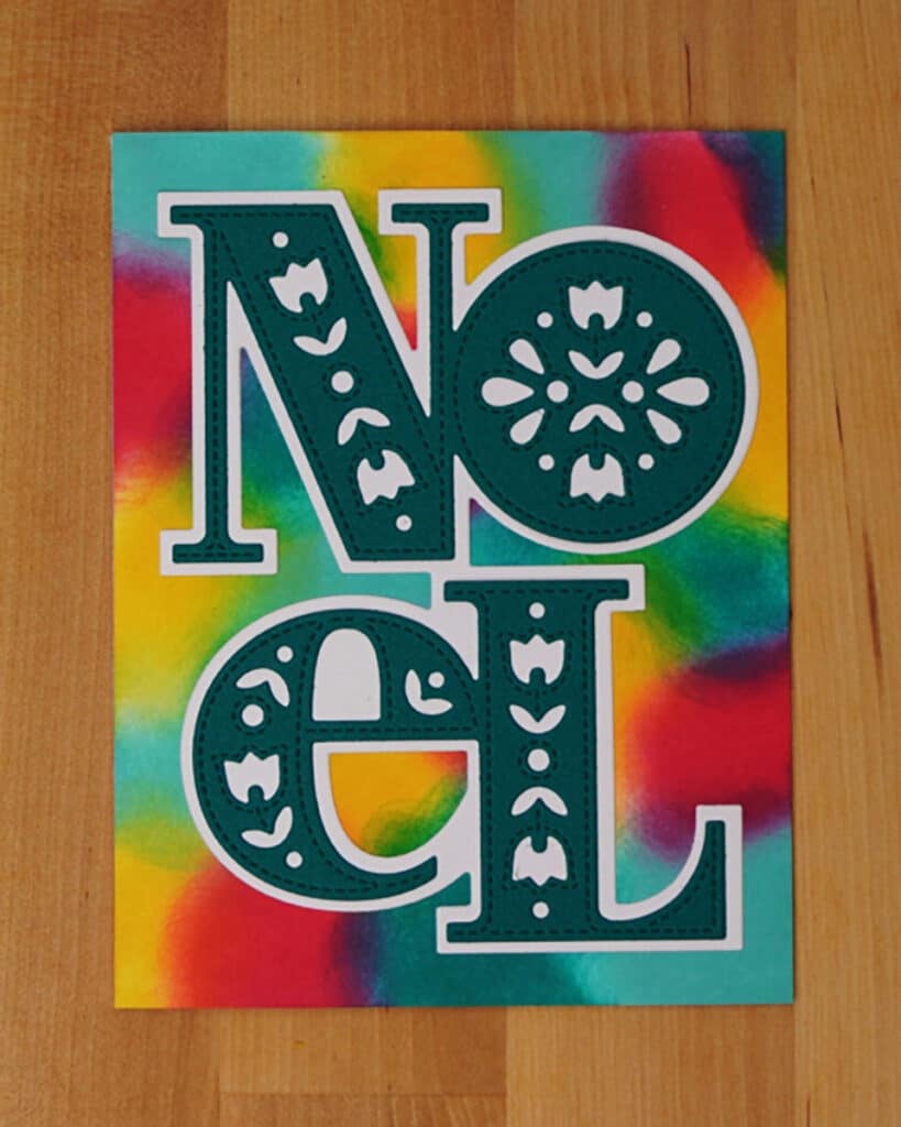 More unique colors used for a random background that gives this card a stained glass type look.