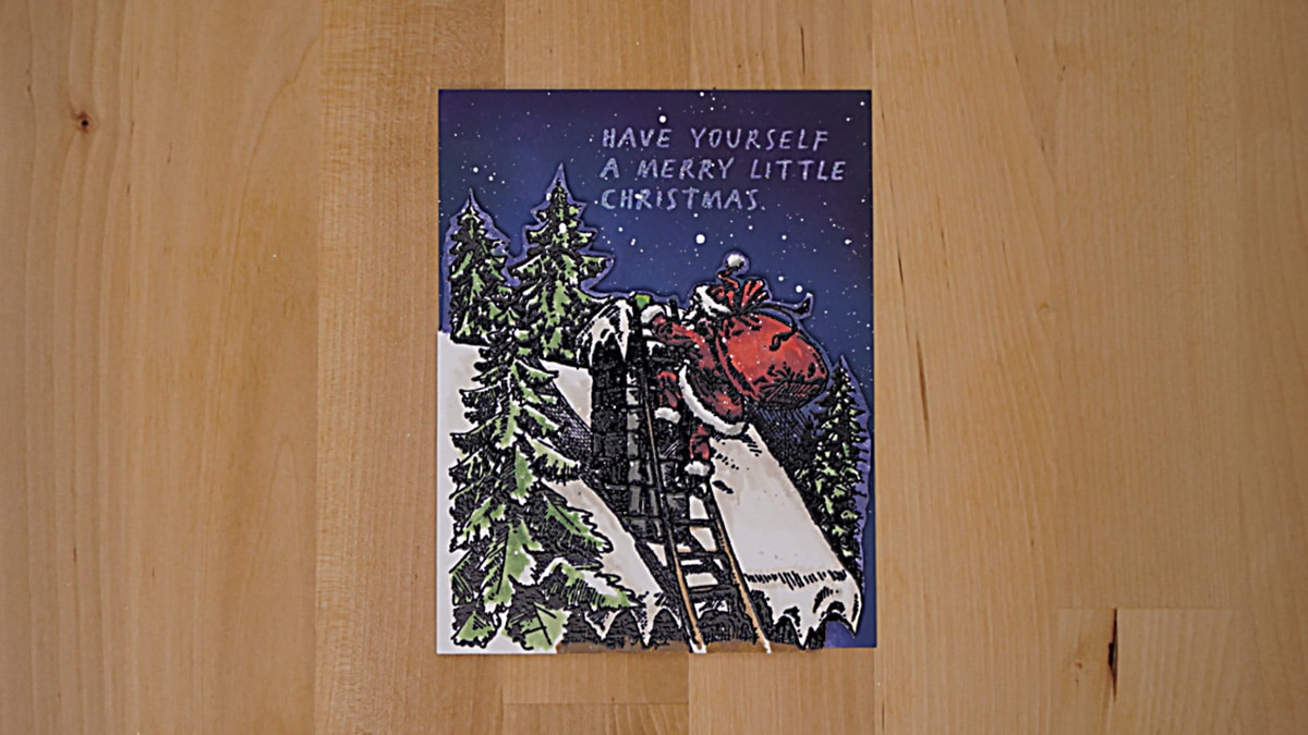 Beautiful nighttime Christmas Card with Santa Clause climbing up the Chimney. The car has a beautiful blended sky and the focal point is painted with Distress Oxides.