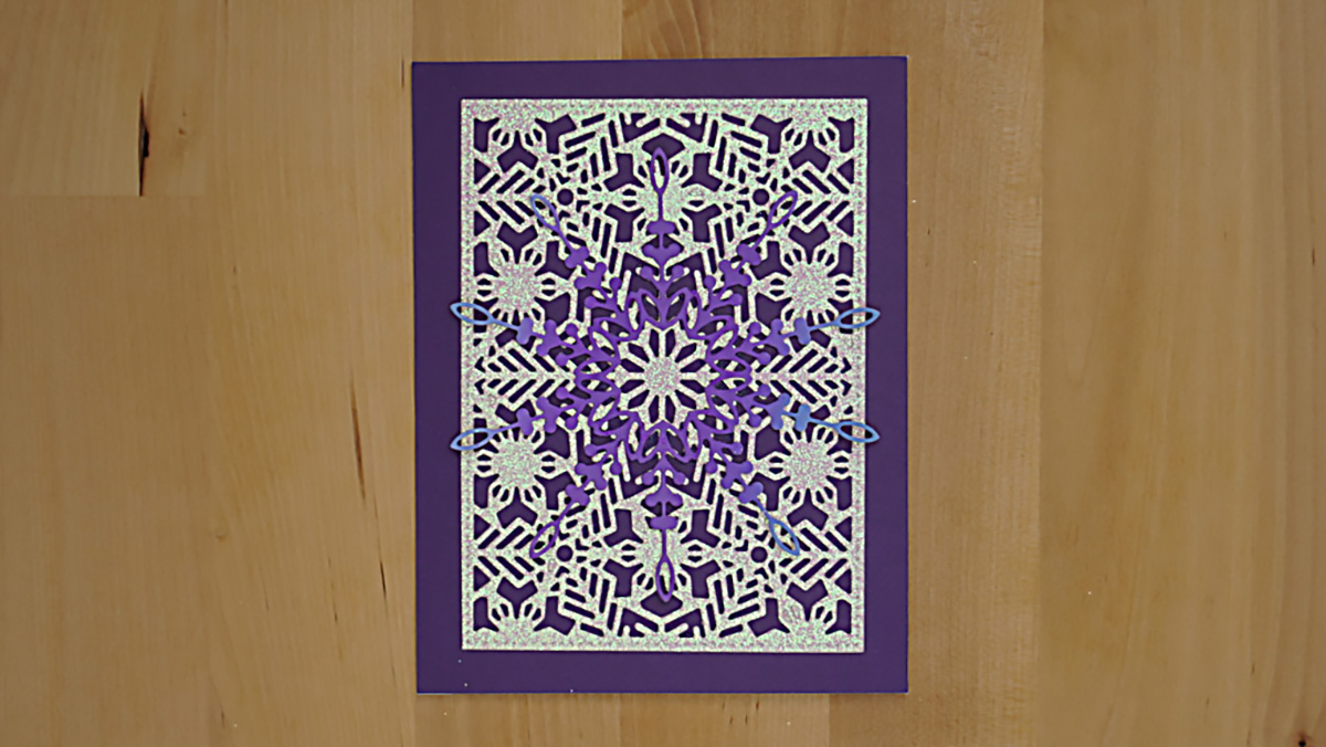 Day 18 of the Twenty-five Days of Christmas Cards is a sparkly snowflake card made with dies and glitter cardstock.