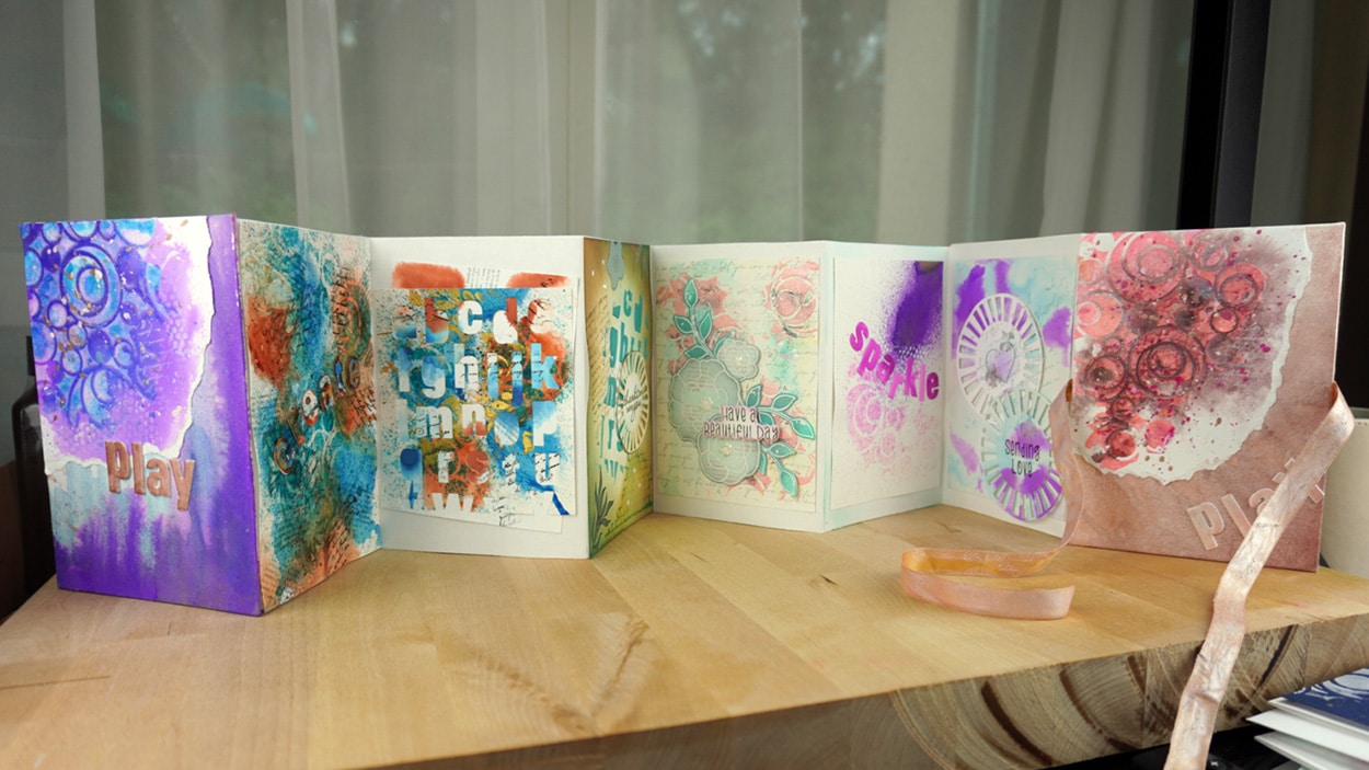 Accordian book filled with mixed media projects.