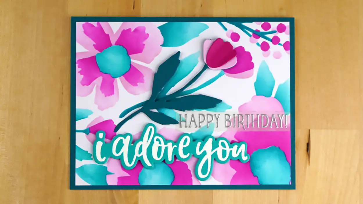 We explore the possibilities of stencils while making this beautiful birthday Card with added detailing from die-cuts.