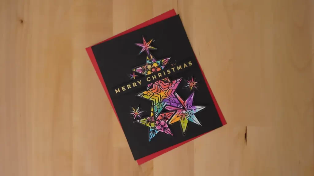 Gorgeous rainbow stars are front and center for Day 24 of the Twenty-Five Days of Christmas Cards.