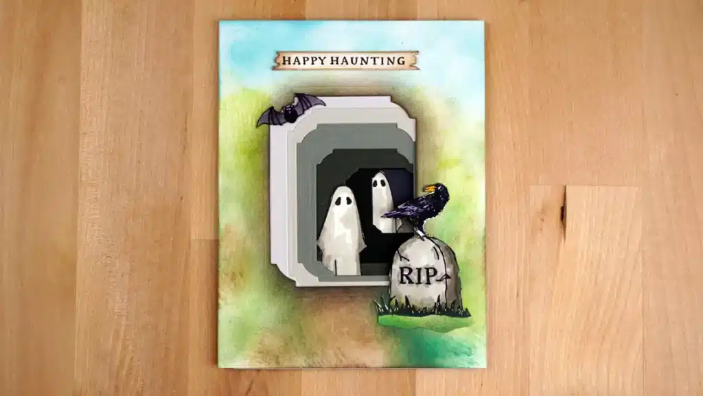 Card 1 of 2 spooky halloween cards uses BetterPress plates an dies from Spellbinders August 2023 release to depict ghosts and other spooky things in a cave.