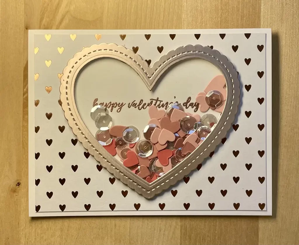 Lovely shaker valentine with rose gold  mirror cardstock and pretty colored hearts and sequins.
