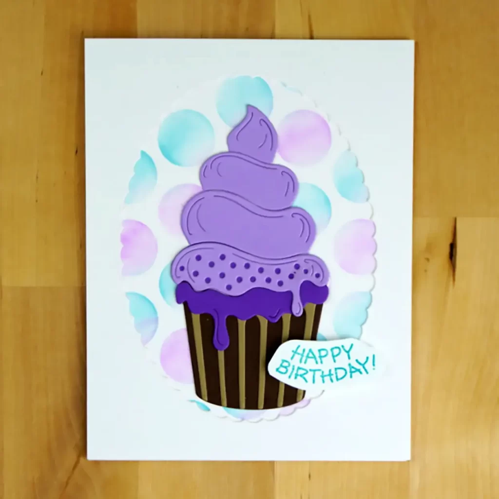  Birthday card featuring a cupcake with purple icing created using Spellbinders Large Die of the Month.
