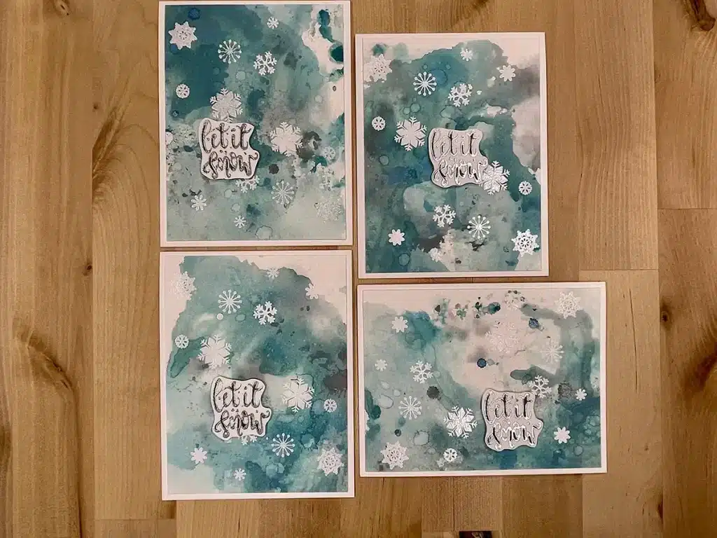 Four winter cards with snowflakes and a tea backgrouond