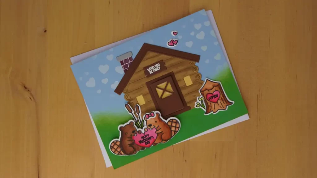Cute log cabin valentines created with dies, stenciling and coloring with alcohol markers