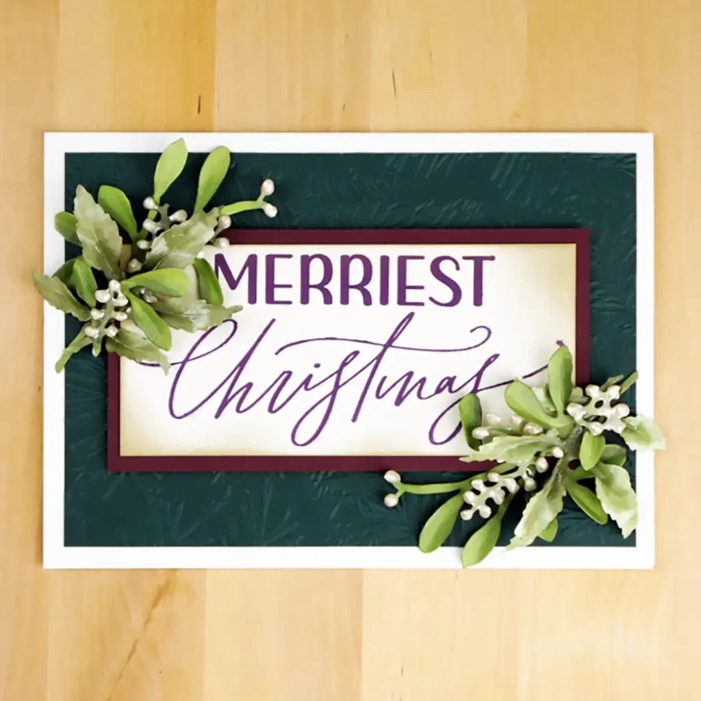 Card 6 of 6 BetterPress Christmas cards is an elegant card in deep gem tones and features life like mistletoe and winterberry.