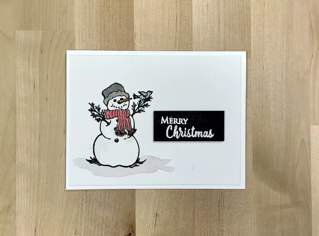 Christmas card with a Watercolored Snowman.