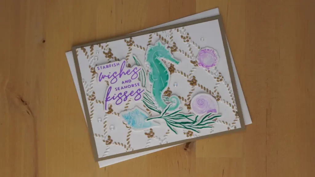 Starfish wishes and Seahorse Kisses card with a kraft-colored fish net.