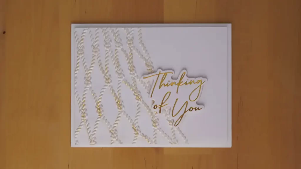 Clean and simple card featuring an embossed fishnet background with a foiled sentiment stating you're 