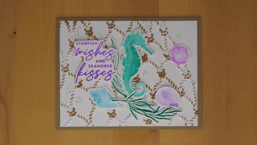 Starfish wishes and Seahorse Kisses card with a kraft-colored fish net.