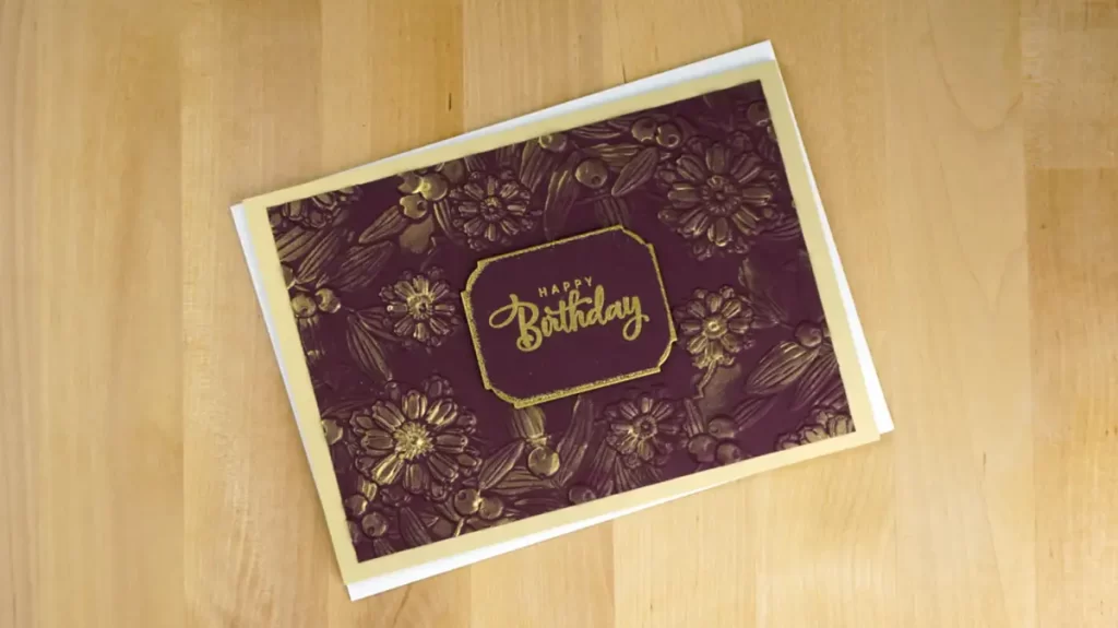 Elegant Birthday card embossed using Spellbinders' Notched Corners Floral Embossing Folder and colored with metallic paste.