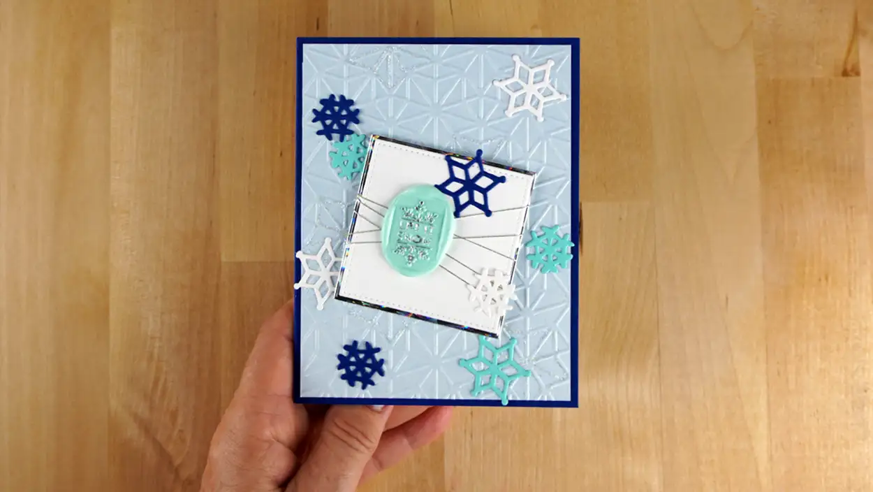 Beautiful winter card featuring a wax seal from Spellbinders' September release. And, it has a surpise inside.