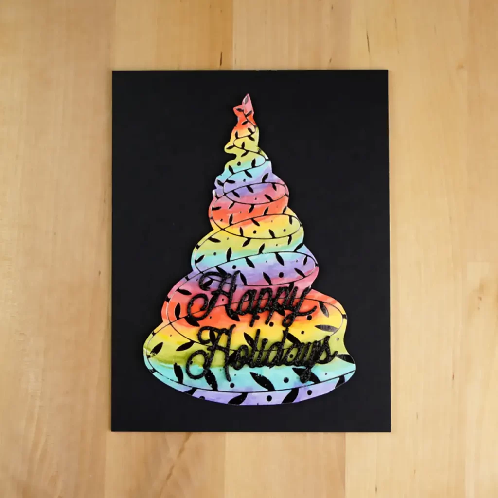 Who doesn't love a rainbow?  Well what about on a Christmas tree?  That is how this Christmas card is colored.