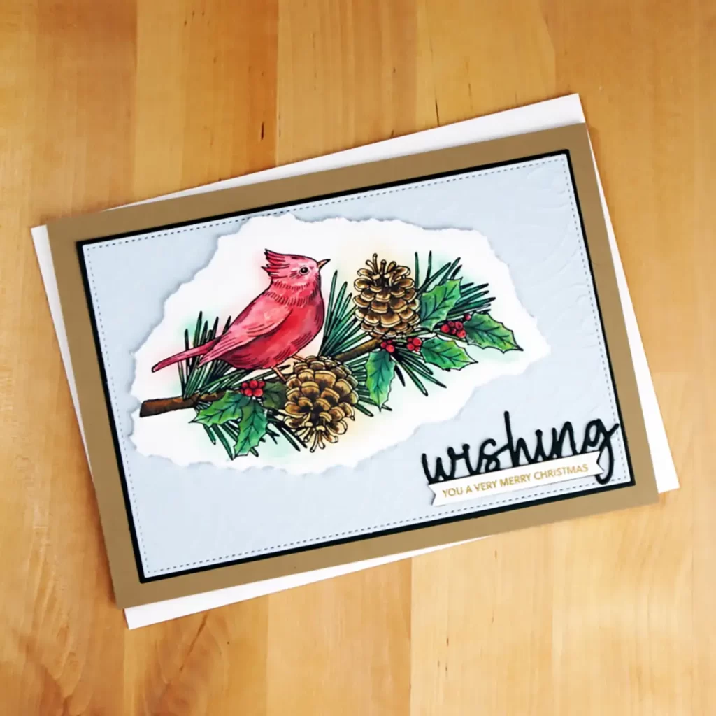 Card 4 of 6 BetterPress Christmas Cards showcases a beautiful red cardinal on a pine branch which has been painted with Distress Oxides.