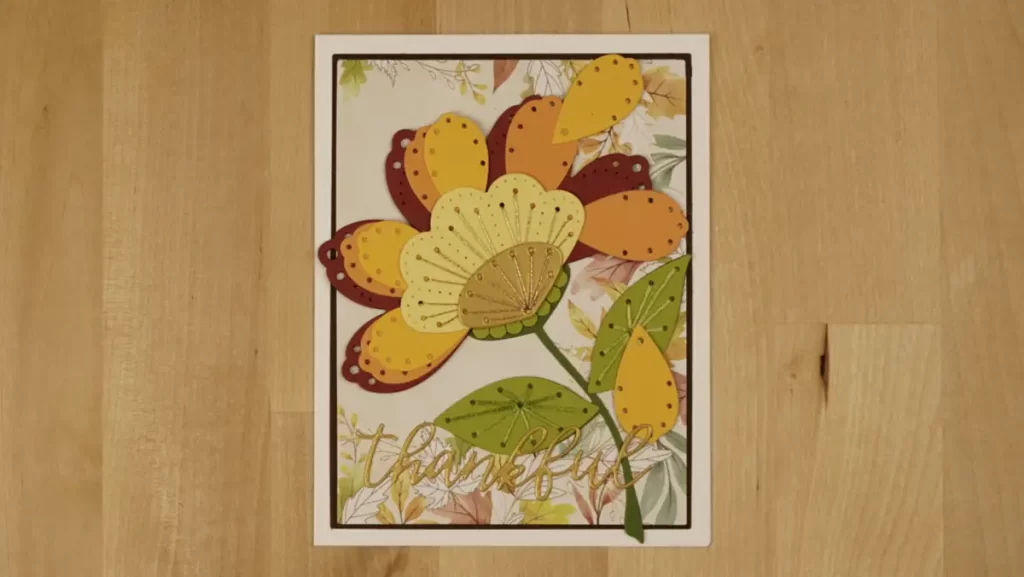 Pretty fall card featuring a flower whose petals are flying in the wind.