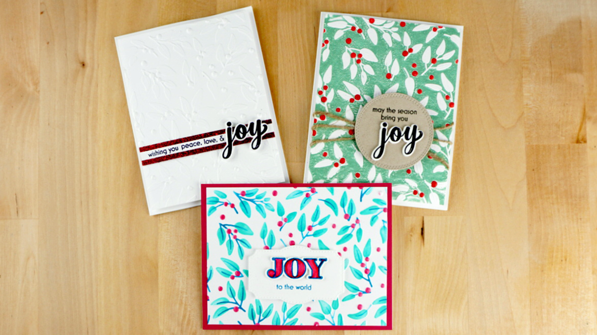 Three beautiful Christmas cards embossed and stenciled with Altnew's Joyful Greenery and sentiments using Joyful Greetings from their October 2023 release.