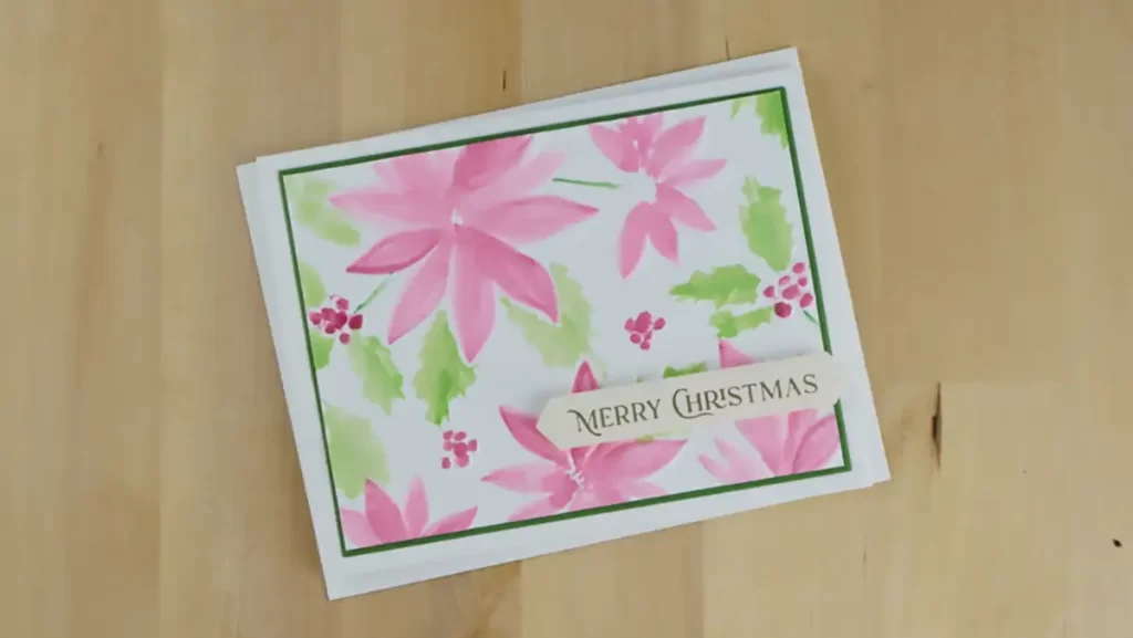 Beautiful embossed and watercolored Christmas card created using Simon Hurley's Playful Poinsettia embossing folder.