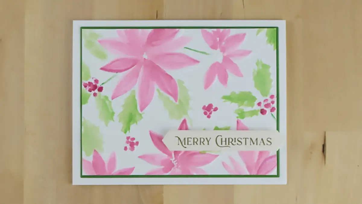 Beautiful embossed and watercolored Christmas card created using Simon Hurley's Playful Poinsettia embossing folder.