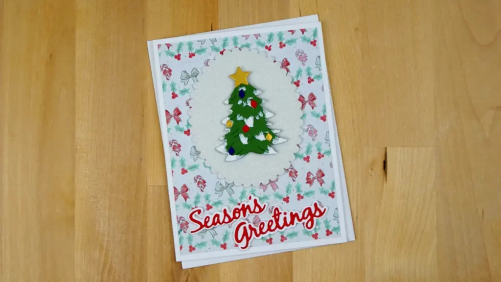 Pretty Christmas card featuring a Christmas tree created using Spellbinders Build-A-Wreath and Christmas Add-on die sets.
