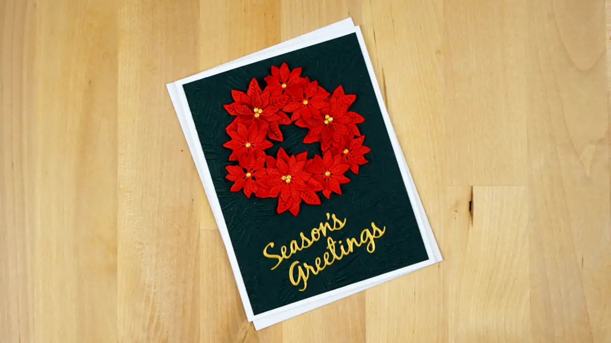 Stunning Christmas card featuring a poinsettia wreath created using Spellbinders Build-A-Wreath and Christmas Add-on die sets.