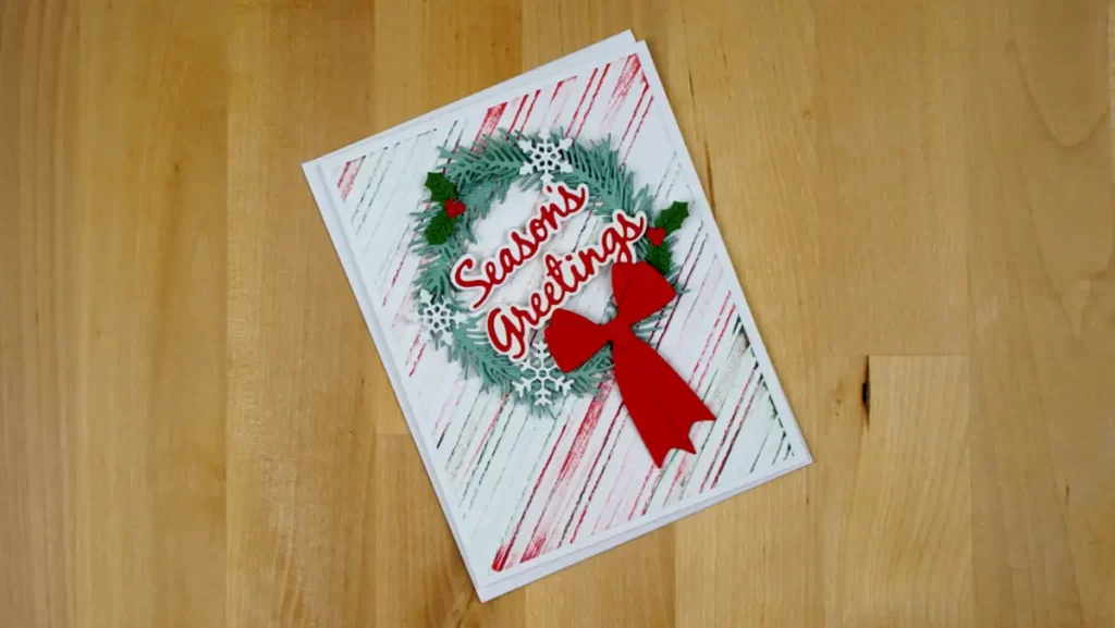 Lovely Christmas card featuring a Christmas wreath created using Spellbinders Build-A-Wreath and Christmas Add-on die sets.
