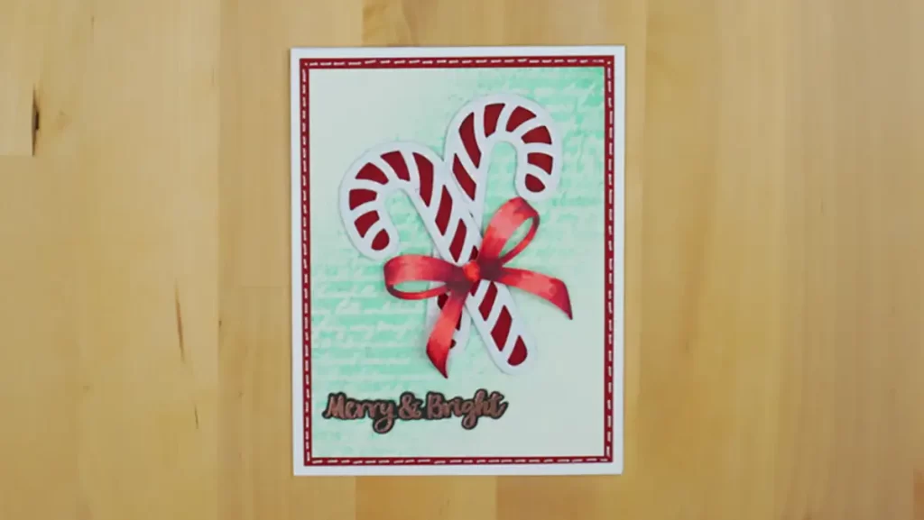 A card with a candy cane and countdown to Christmas on it.