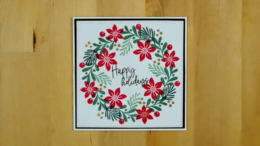 A card featuring a stunning poinsettia wreath, adding to the excitement of the Countdown to Christmas.