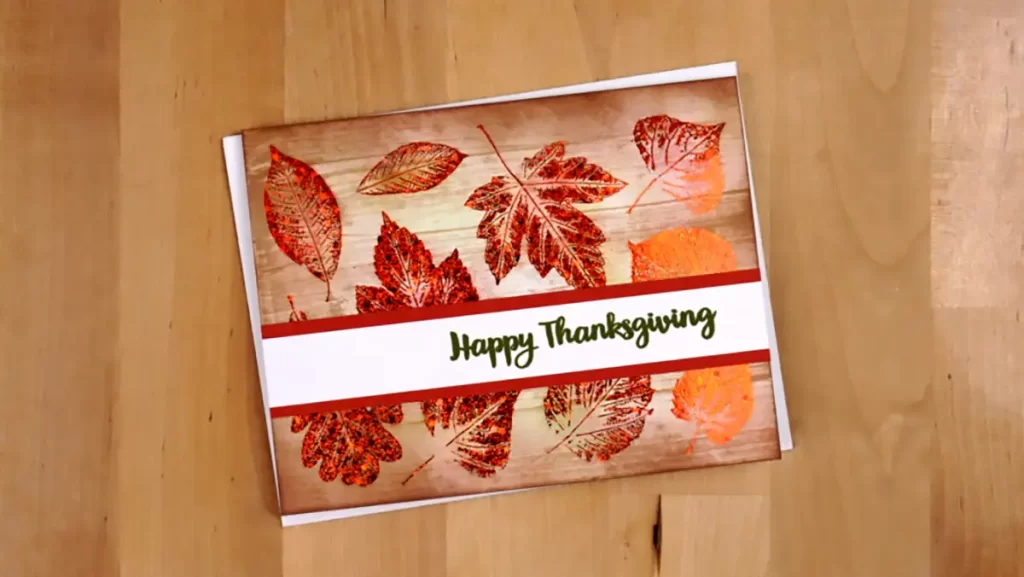 A happy thanksgiving card with leaves on it.