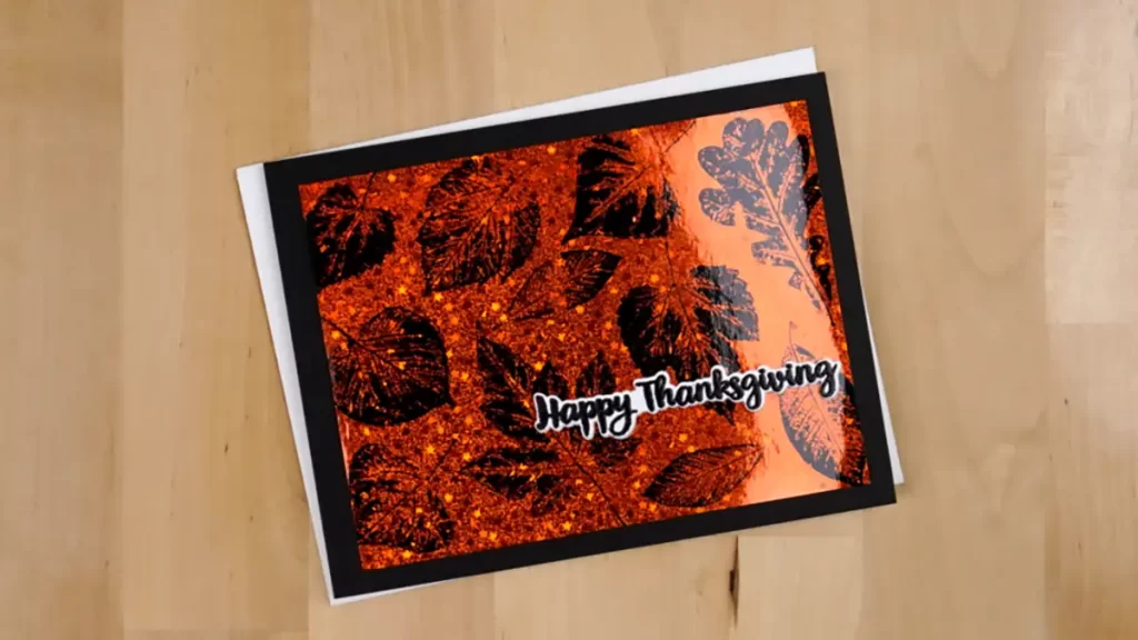 An orange and black greeting card with the words happy thanksgiving.