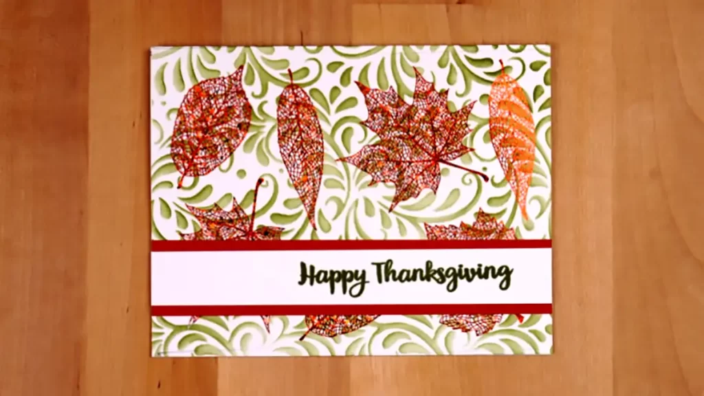 A happy thanksgiving card with leaves on it.