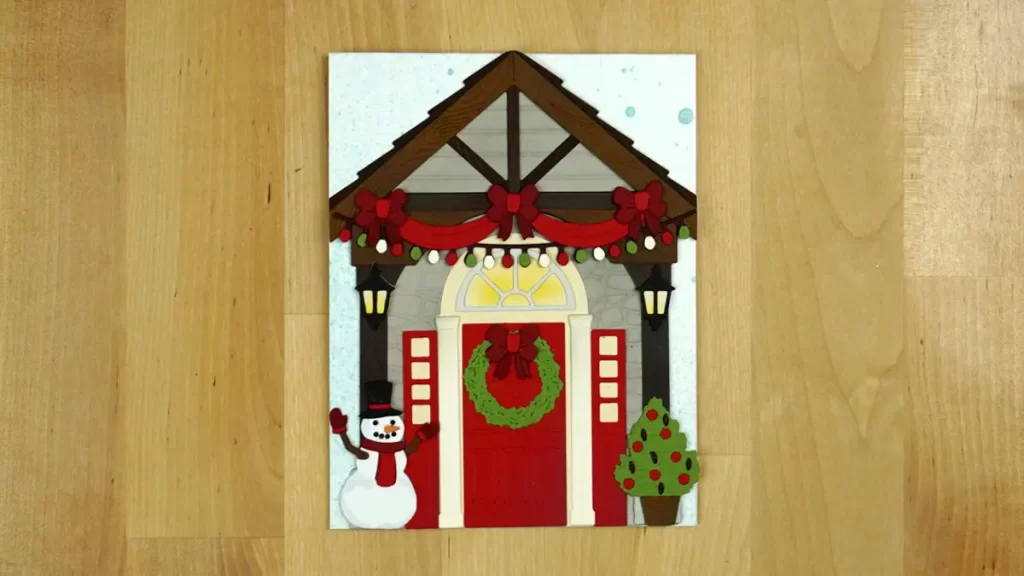 A countdown to Christmas door hanging on a wooden floor.