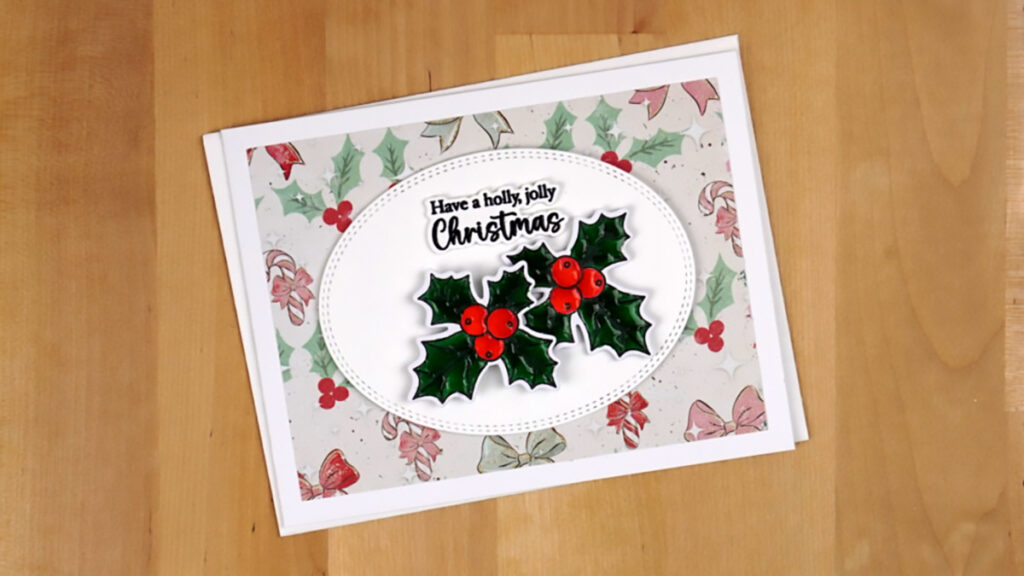 Get in the festive spirit with a delightful Christmas card adorned with holly leaves and berries.