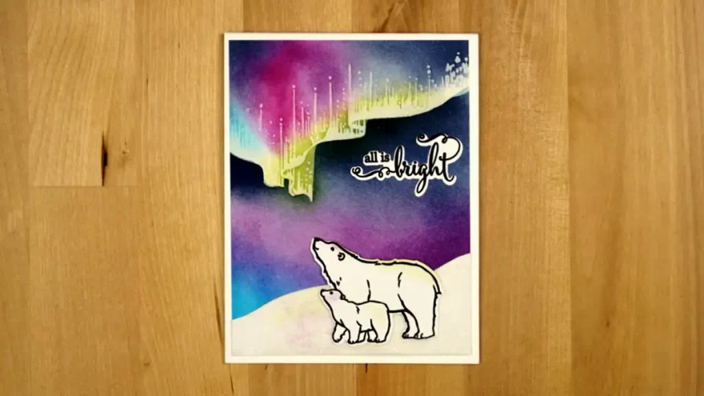 A card with a polar bear and an aurora.