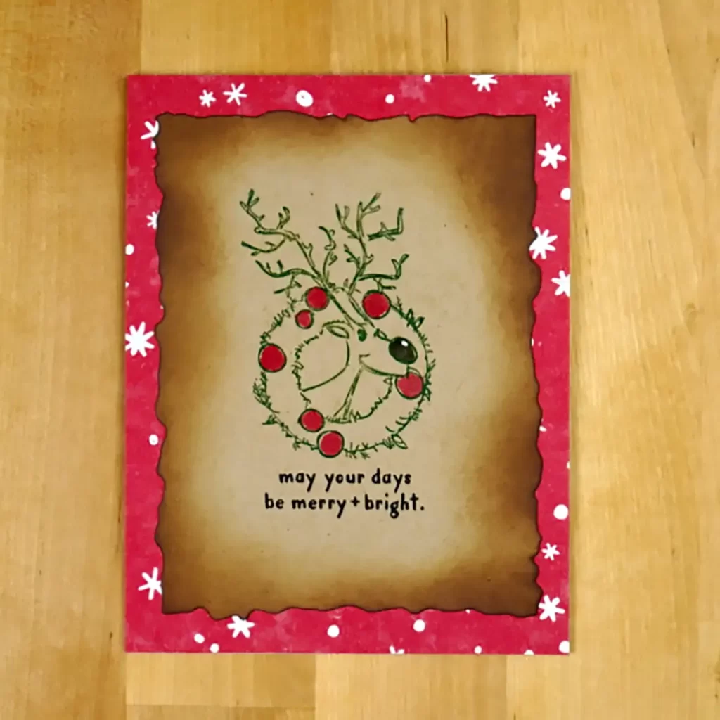 A festive Christmas card featuring a countdown to Christmas and an adorable reindeer design.