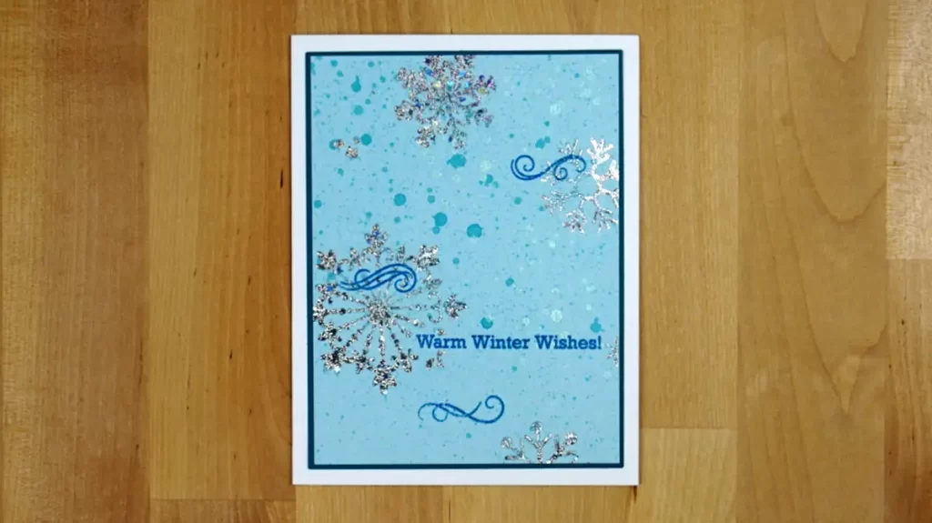 A blue card with snowflakes on it, perfect for counting down to Christmas.