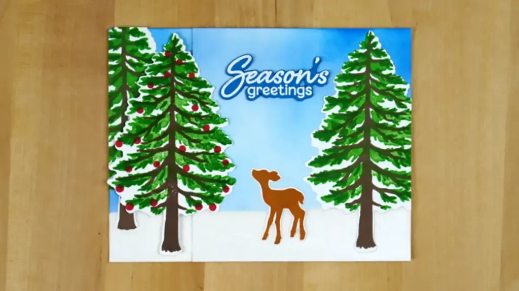 Countdown to Christmas with a festive deer and trees featured on a charming holiday card.