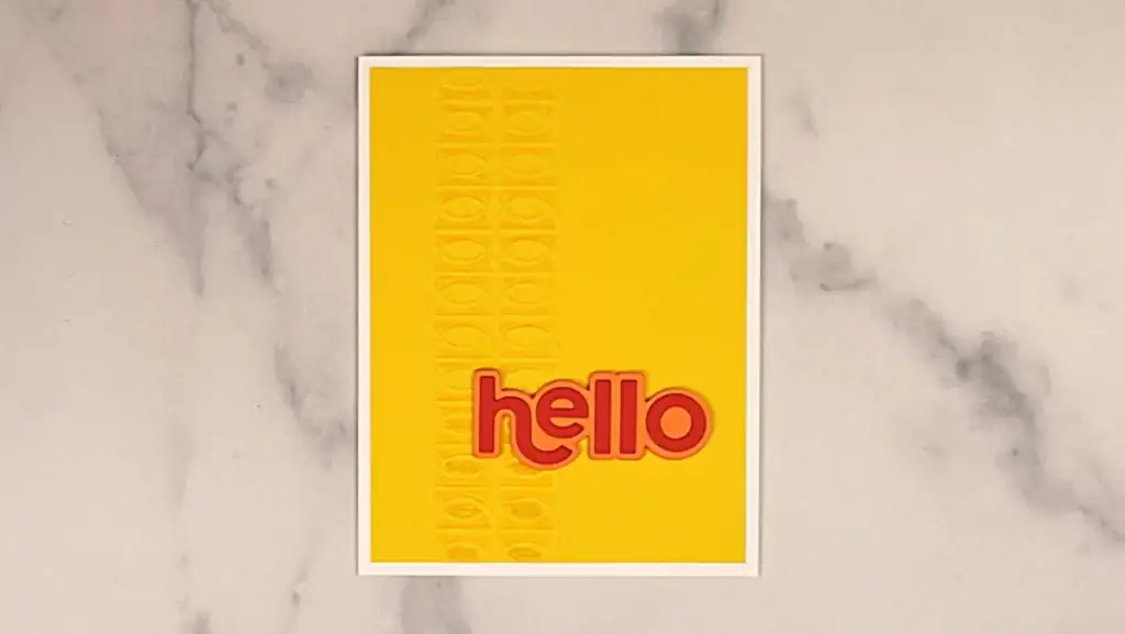 A yellow card with the word hello on it.