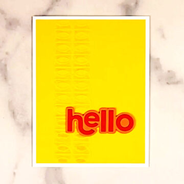 A yellow card with the word hello on it.