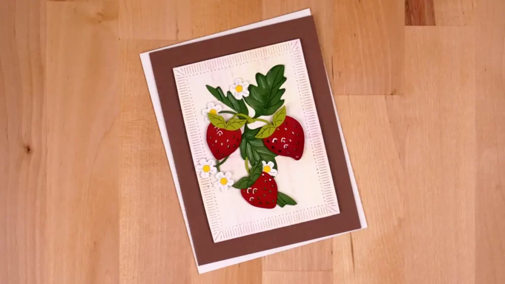 A card with a strawberry bunch on it.