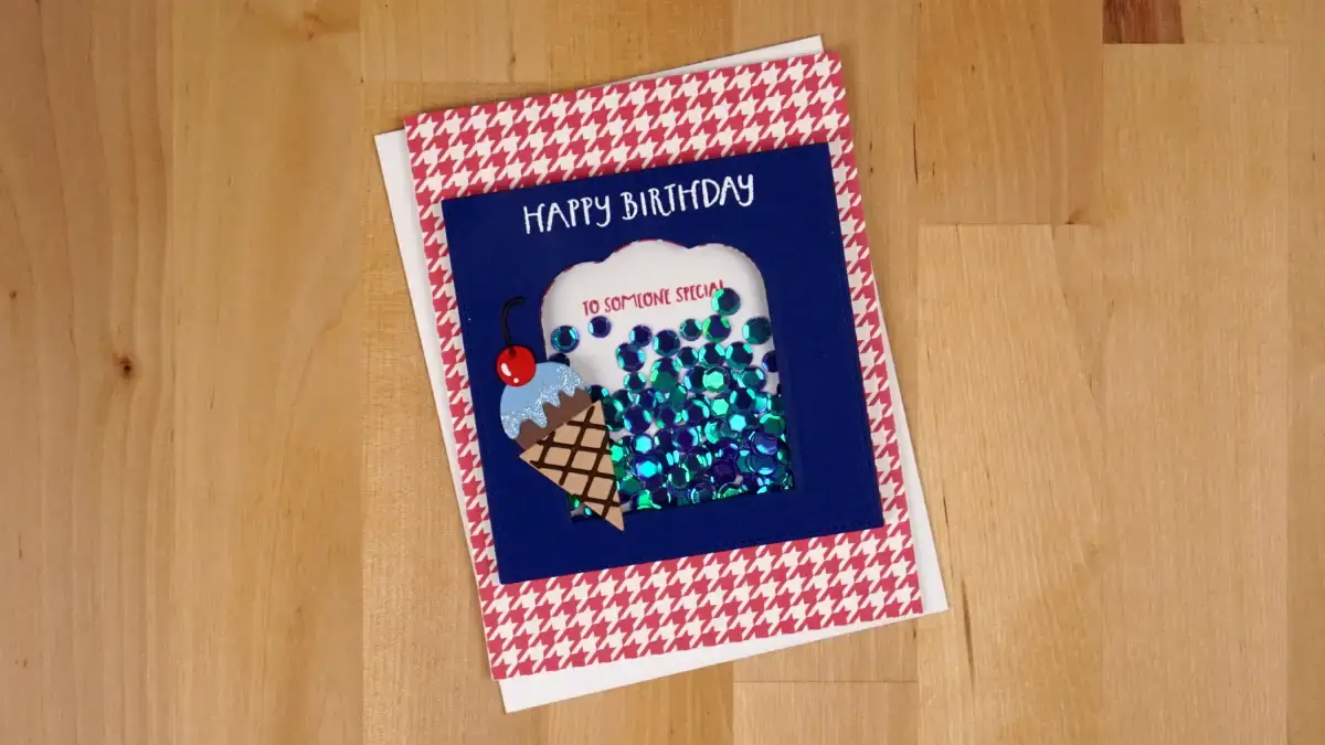 A birthday shaker card with a blue and white houndstooth pattern.
